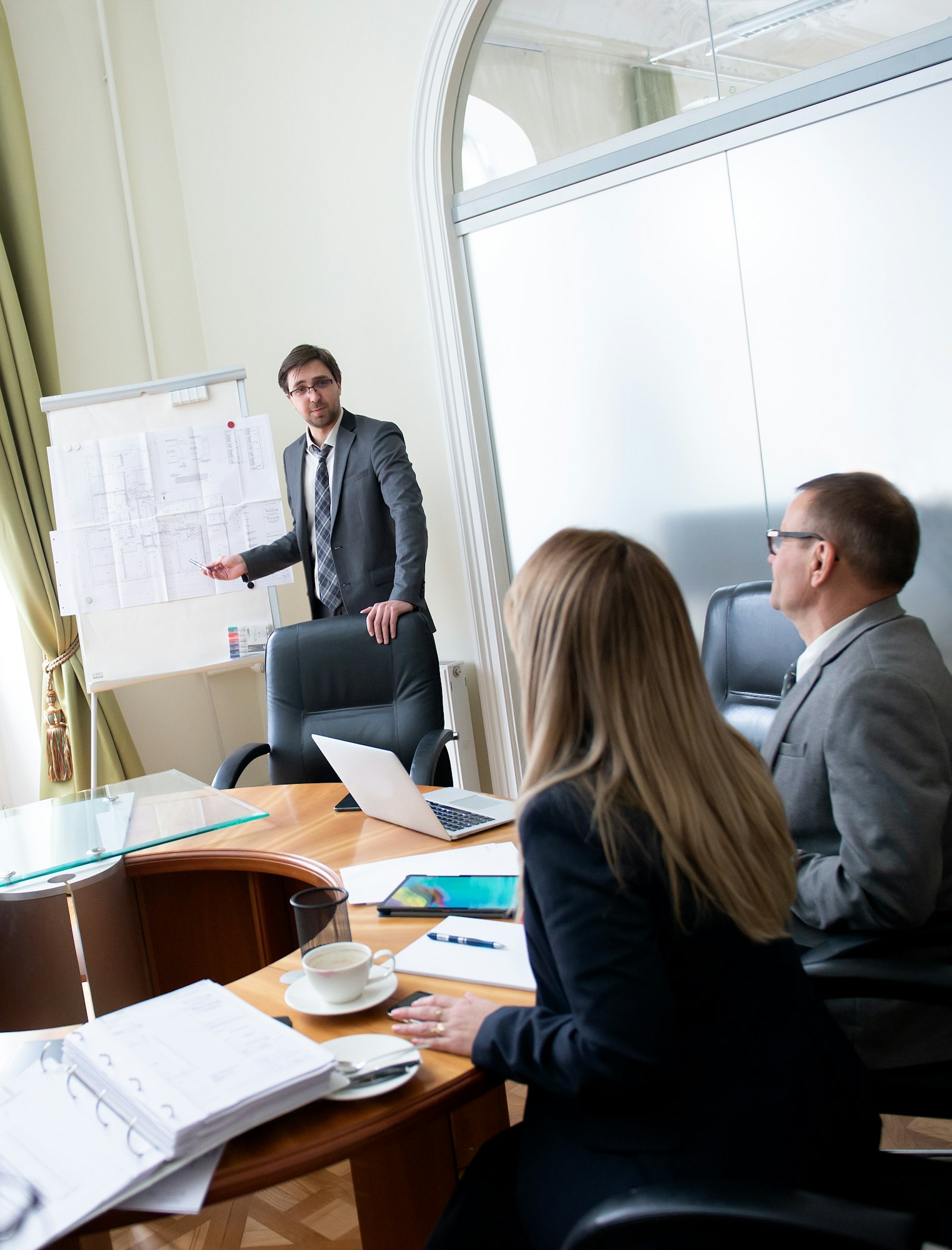 Diverse business team discussing project at corporate briefing in boardroom